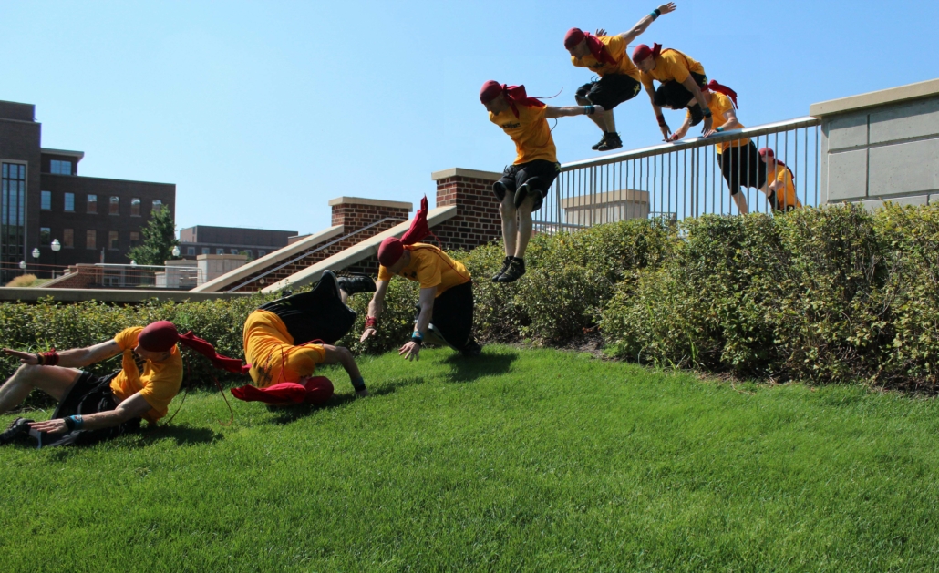 Chad performing a vault to a Parkour shoulder roll.